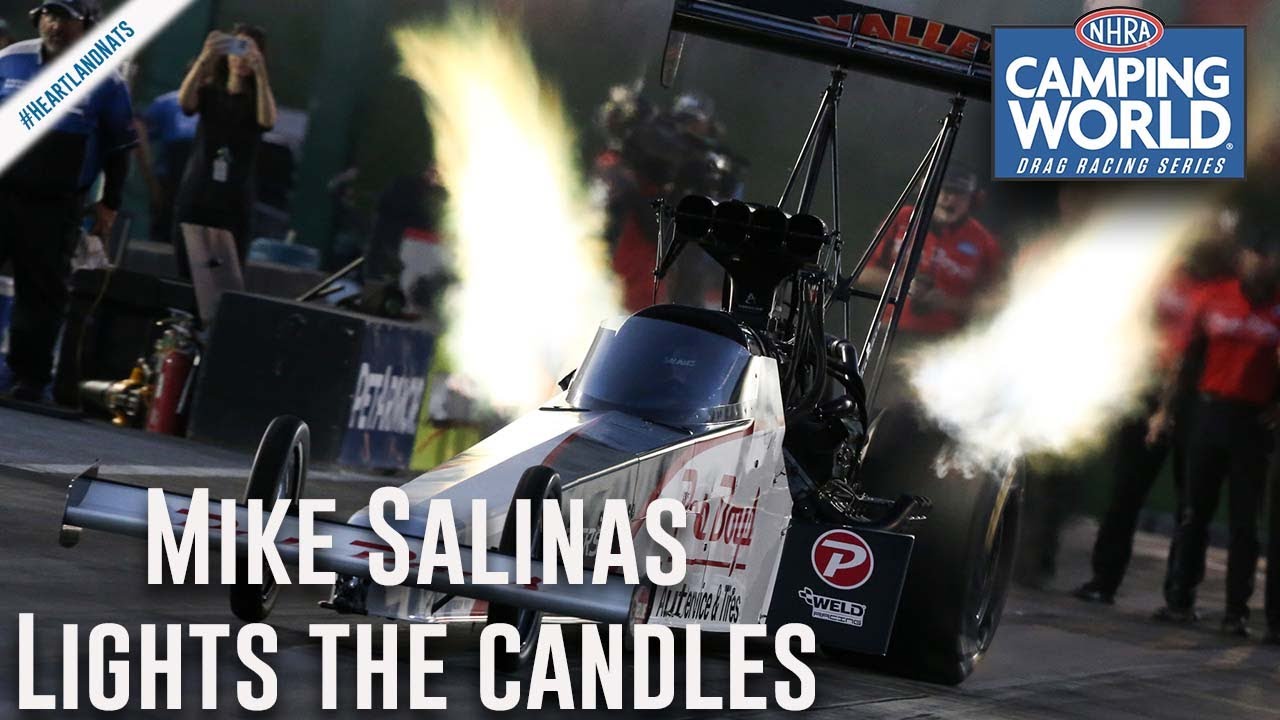 Mike Salinas lights the candles Friday in Topeka